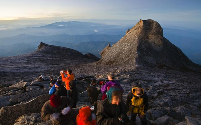 Several hikers at Mount Kinabalu is among the best places to visit in Malaysia for hiking 