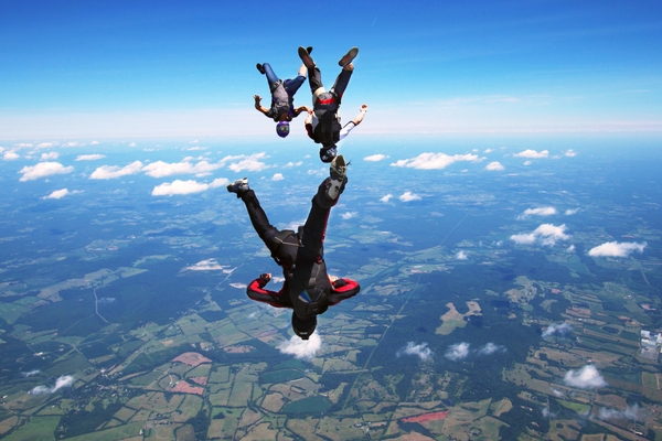 certified skydivers having fun in the sky